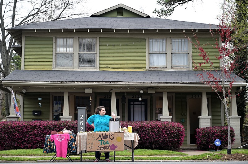 Abbi Siler set up a tea stand in front of her Kavanaugh Boulevard shop as the pandemic hit in March 2020. Siler is closing her current brick-and-mortar space and moving her operations online, with a new location pending. (Democrat-Gazette file photo)