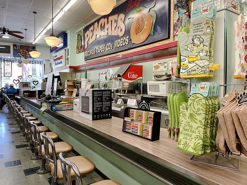 Peaches, a record store in New Orleans, occupies a Woolworth’s department store where sit-ins took place in the 1960s. Visitors can see the original counter and sign from that era. (The Washington Post/Andrea Sachs)