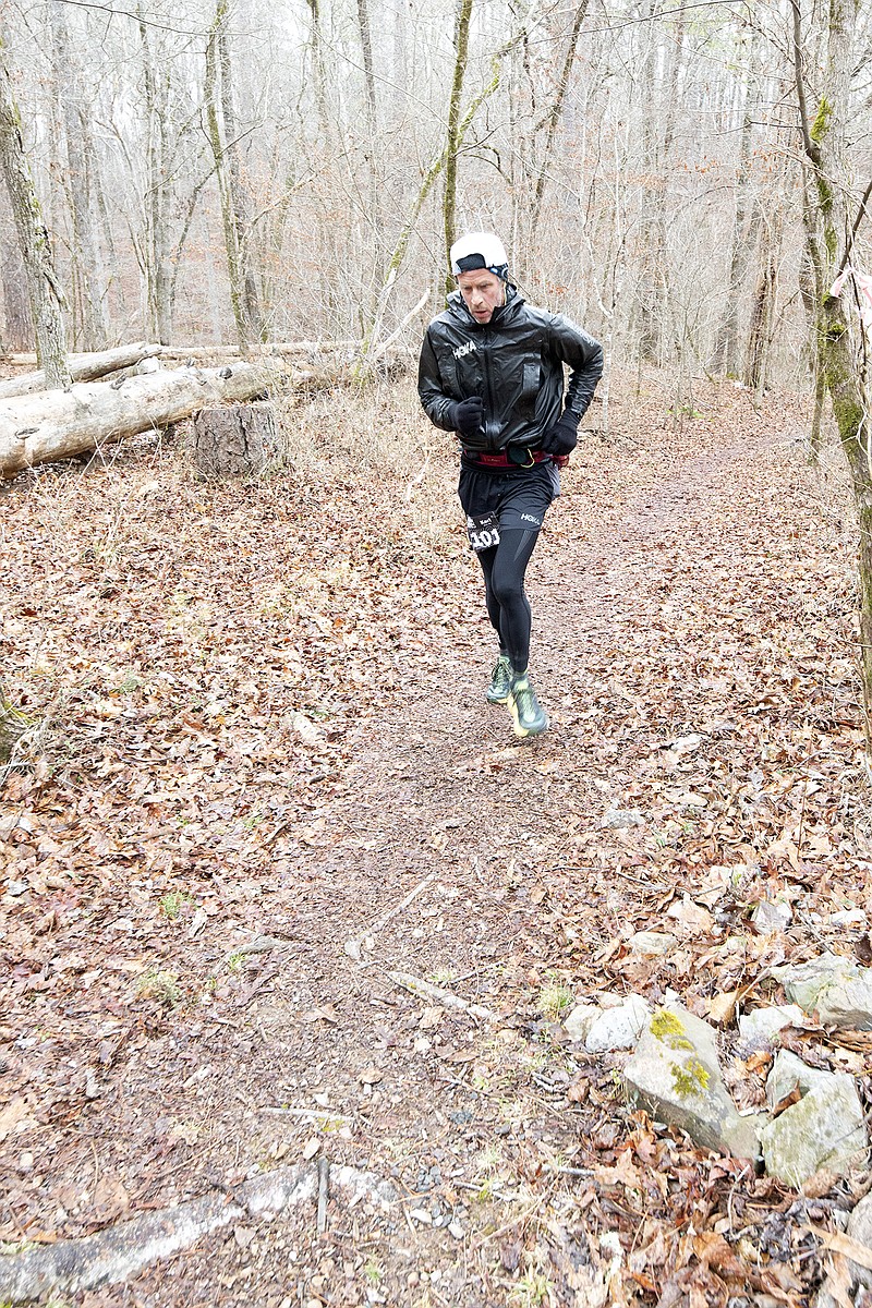 Karl Meltzer makes his way up Hickory Nut Mountain in one of the final legs of the 100-mile LOViT 100 race. The top ultra-marathoner in the world picked up his 46th 100-mile race win while setting a new course record. - Photo by Corbet Deary of The Sentinel-Record