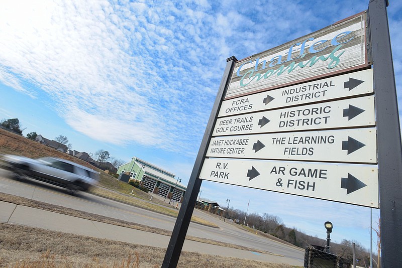 Traffic passes a sign for Chaffee Crossing on Friday, Feb. 11, 2022, in Fort Smith. Visit nwaonline.com/220212Daily/ for today's photo gallery.
(NWA Democrat-Gazette/Hank Layton)