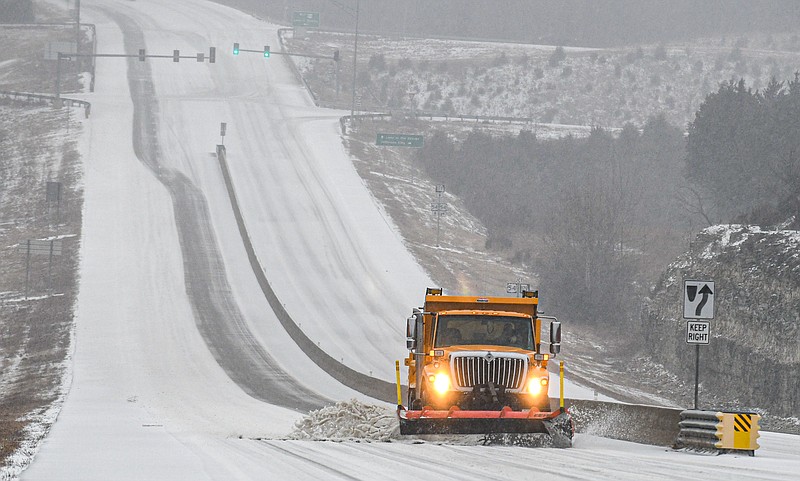 A MoDOT truck clears snow off Missouri 179 on Feb. 17, 2022. (Julie Smith/News Tribune photo)