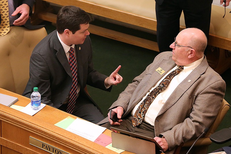 Rep. David Ray (left) talks with Rep. John Payton before the House session on Tuesday, March 1, 2022, at the state Capitol in Little Rock. 
More photos at www.arkansasonline.com/32house/
(Arkansas Democrat-Gazette/Thomas Metthe)