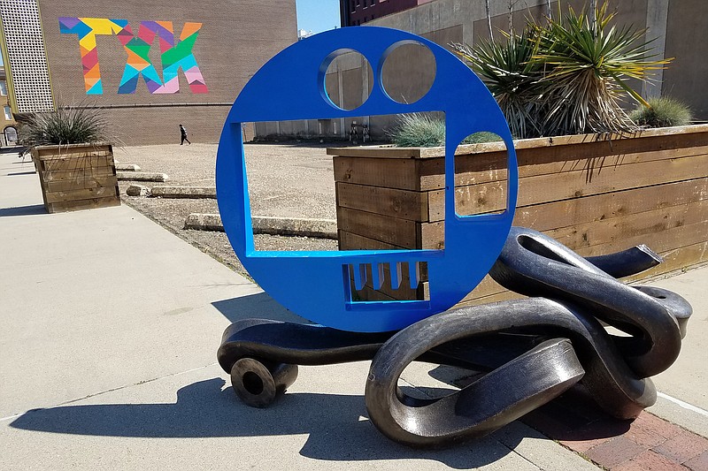 This new George Tobolowsky sculpture was installed Wednesday at West Third and Main streets in Texarkana, Texas. Tobolowsky uses found metal objects as the materials for his art and is working on two sculptures made from items found in the basement of Texarkana's Hotel Grim. (Staff photo by Karl Richter)