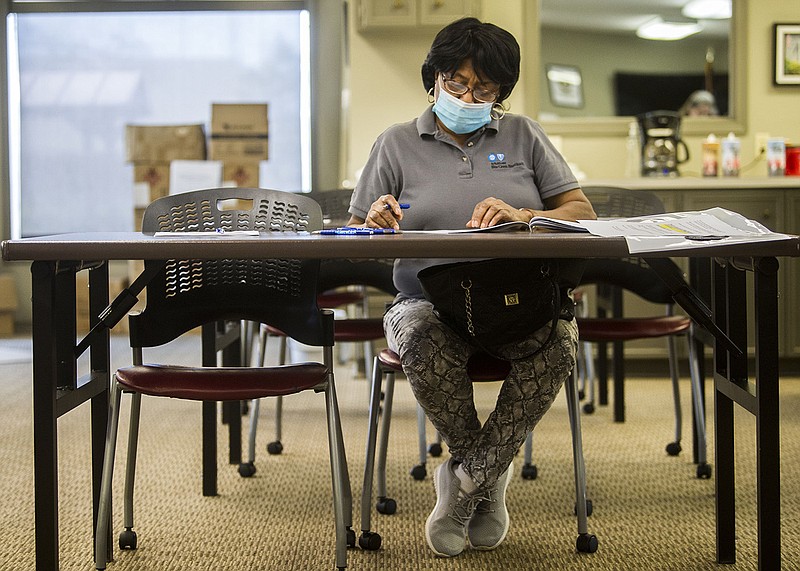 Sheryle Wheeler fills out paperwork during a job fair with CareLink at their offices in North Little Rock on Thursday, March 3, 2022. The event was CareLink's first job fair since the start of the pandemic.

(Arkansas Democrat-Gazette/Stephen Swofford)