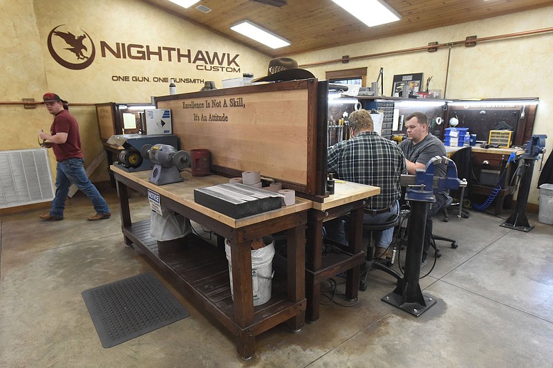 Gunsmiths work on March 2 2022 at Nighthawk Custom in Berryville.
(NWA Demcrat-Gazette/Flip Putthoff)