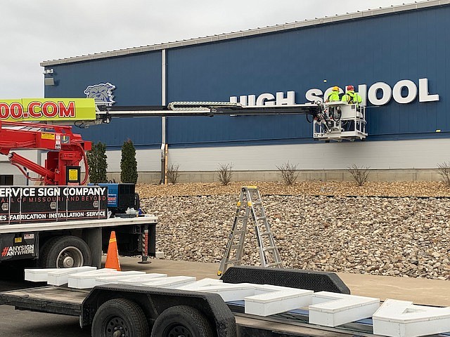 Crews install a new sign to South Callaway High School this week. The sign lights up and is the last bit of a face lift for the school. SUBMITTED