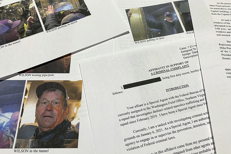 The affidavit in support of the criminal complaint against Duke Edward Wilson is photographed Friday, March 4, 2022. Wilson, from Idaho, who hit a police officer with a pipe while storming the U.S. Capitol last year has been sentenced March 4 to more than four years in federal prison.(AP Photo/Jon Elswick)