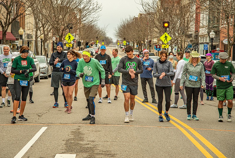 JC YMCA Luck of the Irish 10K runners await the horn to start the annual race Saturday in downtown Jefferson City.  (Ken Barnes/News Tribune)