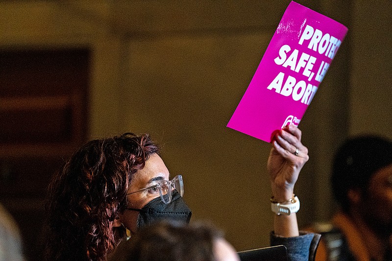 Catherine Betz holds up a sign during a Pro-Choice Missouri rally on Wednesday, March 9, 2022 at the Missouri State Capitol Building. “Abortion is essential healthcare,” Betz said. “It is important that all families have that as one of their options … I want to live in a state where everyone has access to that healthcare.” (Ethan Weston/News Tribune photo)