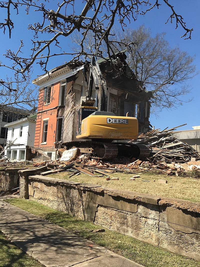 The Claude Fouke house undergoes demolition Thursday in Texarkana, Arkansas. The deconstruction came after the historic house's fate was debated for more than two years by the city, Beech Street First Baptist Church, which owned the property, and the public. The house, which was built in 1903, sat in the city's Quality Hill historic neighborhood. (Staff photo by Greg Bischof)