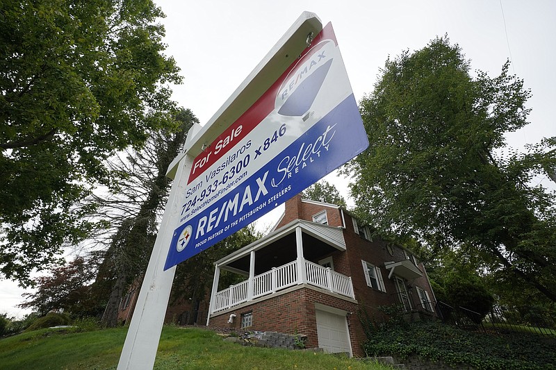 This is a home for sale in Mount Lebanon, Pa., on Tuesday, Sept. 21, 2021. Average long-term U.S. mortgage rates fell slightly this week, after rising to their highest level in three years last week. The average rate on a 30-year loan declined to 3.89% this week from 3.92% the previous week, mortgage buyer Freddie Mac reported Thursday, Feb. 24, 2022. (AP Photo/Gene J. Puskar)