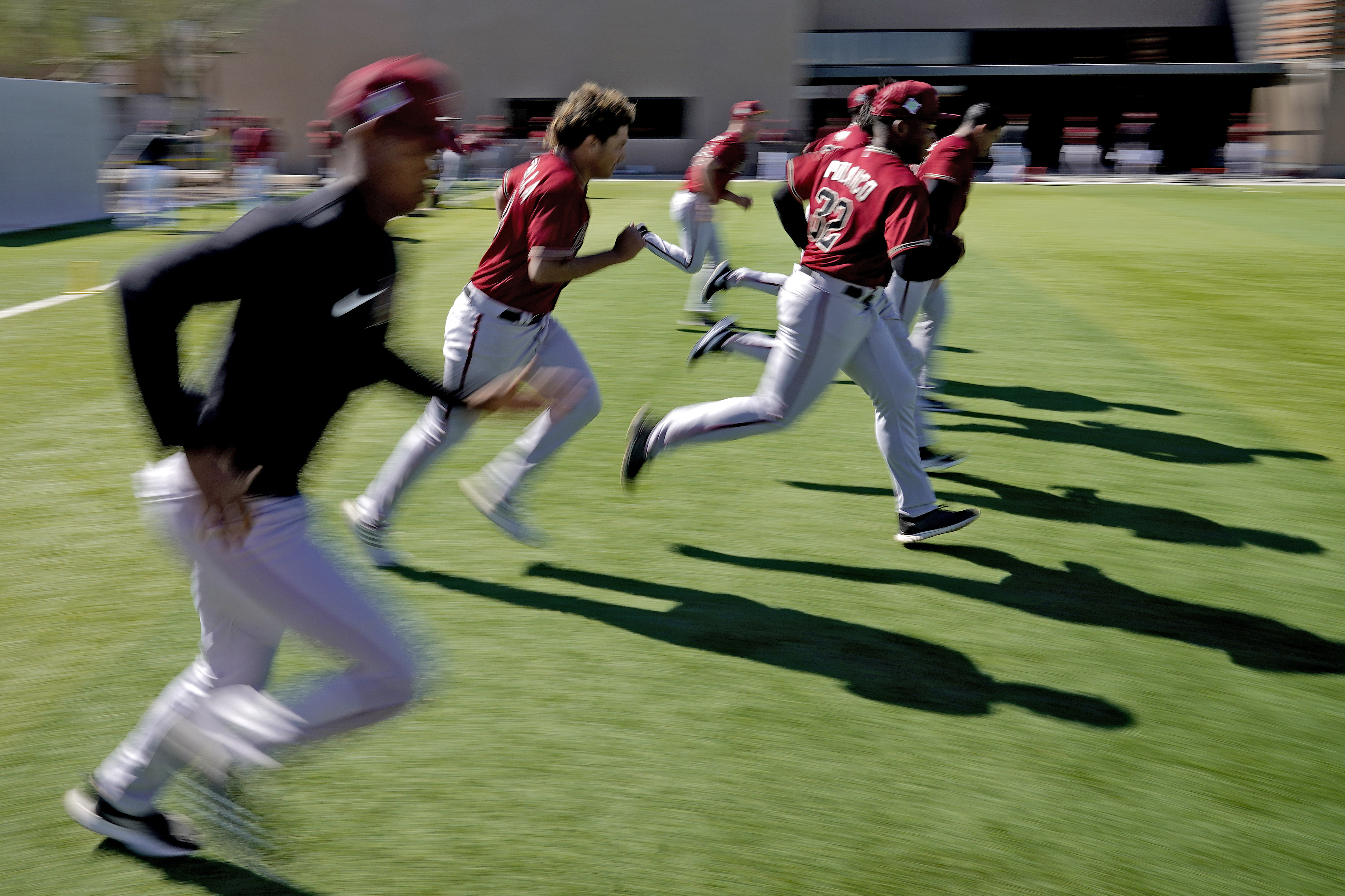 Baseball's bickering is over; spring camps open