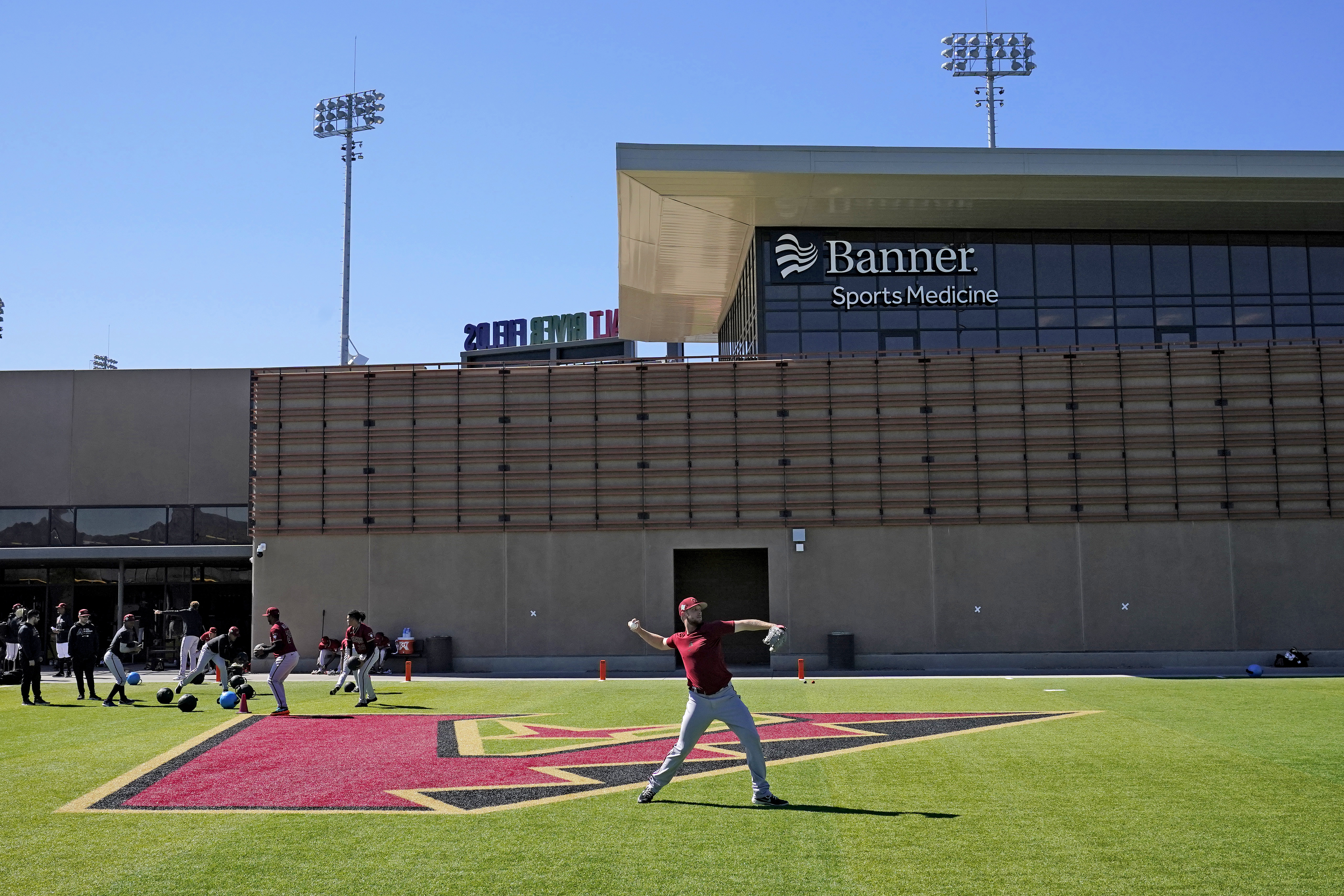 Baseball's bickering is over; spring camps open