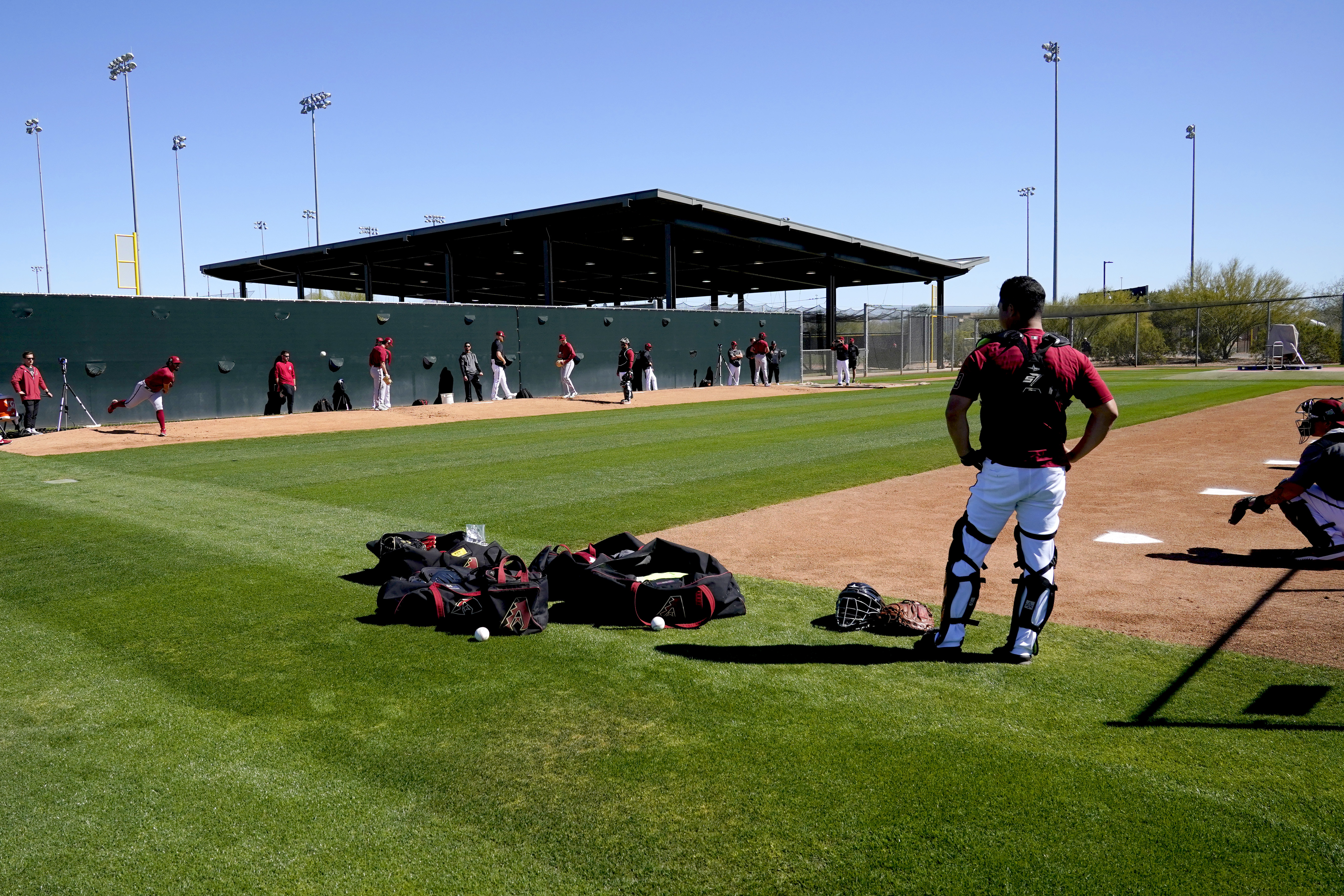 Baseball's bickering is over; spring camps open