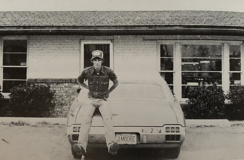 In this 1980 photo, a high school friend of columnist John Moore sits on the trunk of John's 1972 Oldsmobile Cutlass Supreme. (Photo by John Moore)