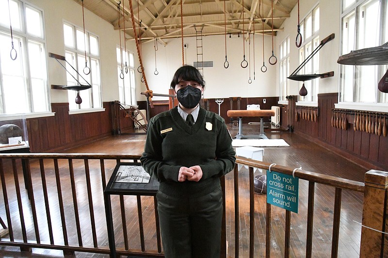 Ashley Waymouth, supervisory park ranger, is shown in the Fordyce Bath House’s gym, a popular spot for tourists. - Photo by Tanner Newton of The Sentinel-Record
