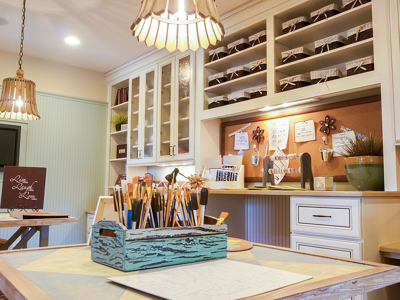 A combination of open and hidden storage, a vision board and tools at hand help crafters unleash their inner artists at home. (Courtesy of Dreamstime)