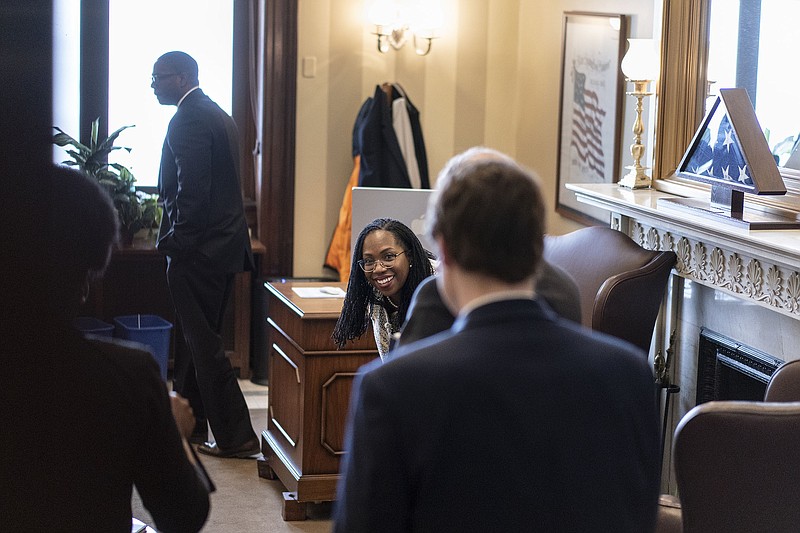 Supreme Court nominee Ketanji Brown Jackson smiles as she waits in Sen. Tom Cotton's, R-Ark., office before their meeting on Capitol Hill in Washington, Tuesday, March 15, 2022. If confirmed, she would be the court's first Black female justice. (AP Photo/Carolyn Kaster)