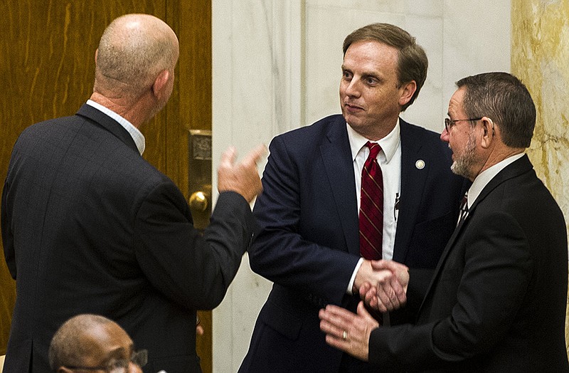 Arkansas Representative Bruce Cozart, R-Hot Springs, left, and Representative Ron McNair, R-Alpena, right, congratulate Matthew Shepherd, R-El Dorado, on being elected to Speaker of the House for the third consecutive term during a meeting of the House of Representatives on Tuesday, March 15, 2022.

(Arkansas Democrat-Gazette/Stephen Swofford)