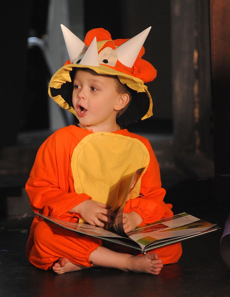 Cast members of "Dinosaur Daze" performed at the Itsy Bitsy Broadway Theater inside the Capital Mall. Shaun Zimmerman / News Tribune