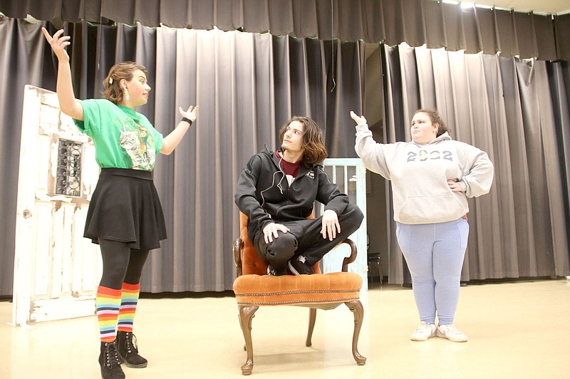 Prairie Grove High School students rehearse one of the scenes in Beauty and the Beast in the high school's commons area last week. In this scene, Lumiere, played by senior Hailey Skoch, left, and Mrs. Potts, played by senior Angelina Dickson, try to persuade the Beast, played by 10th grader Liam VanDerhorn, to ask Belle to dinner.