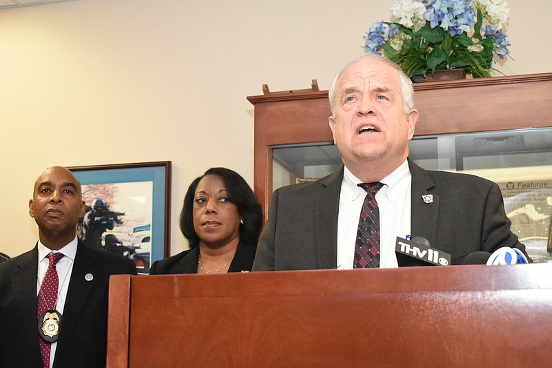 Arkansas State Police Director Col. Bill Bryant addresses members of the media as Lt. Robert Wilson and Criminal Investigation Department acting commander Capt. Paulette Ward, both with the state police, look on at the Southeast Arkansas Law Enforcement Center on Sunday, in Dumas. (Pine Bluff Commercial/I.C. Murrell)