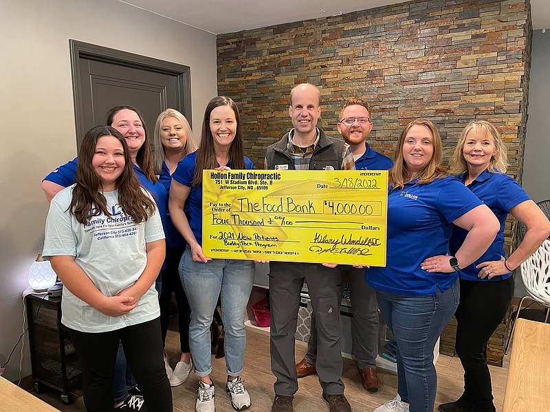 Dr. Hilary Hollon and her staff present a $4,000 donation to Food Bank Regional Manager Darren White. All funds will go toward the organization's "Buddy Pack" program for bags of food given to children and their families. 
(Left to right) Zoe Barns, Ashley Ray, Hannah Anglen, Dr. Hilary Hollon, Darren White, Taylor Dane and Dr. Allie Davidson. (Democrat photo/Kaden Quinn photo)