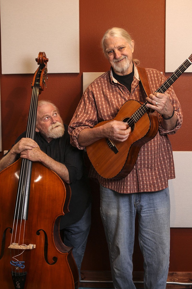 On the Cover:

Their disparate heights are a running joke for Trout Fishing in America musicians Keith Grimwood (left) and Ezra Idlet. The difference, in case you’re wondering, is 15 inches.

(Courtesy Photo)