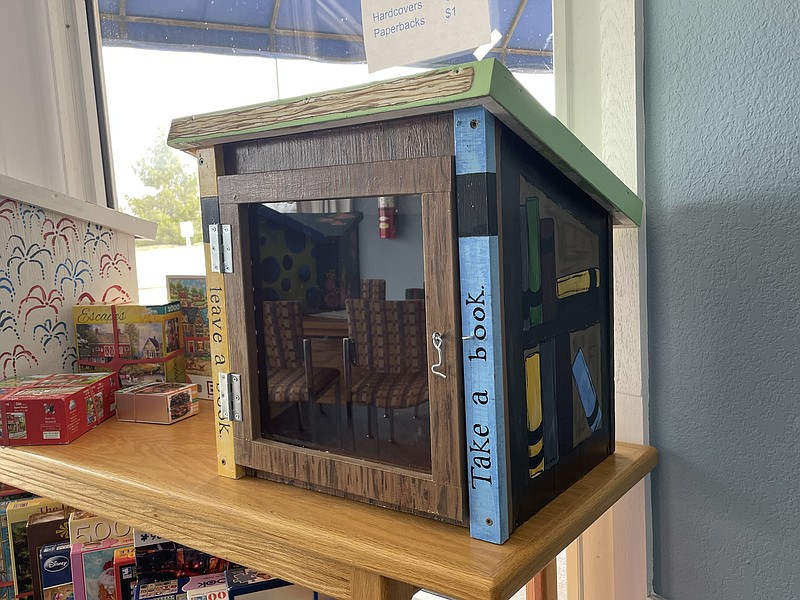 The Moniteau County Library holds the Little Free Libraries installations in its front window until they can be placed throughout the area. (Democrat photo/Kaden Quinn photo)