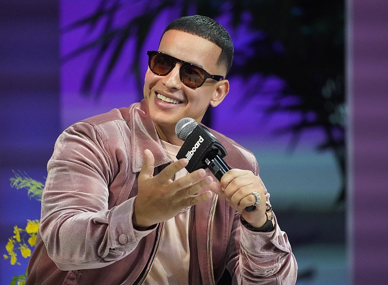 FILE - Puerto Rican singer Daddy Yankee speaks during a panel at Billboard Latin Music Week, in Miami Beach, Fla, on Sept. 22, 2021.  The reggaeton star announced on Sunday March 20, 2022 that he will retire after his farewell tour, "La Última Vuelta," promoting his upcoming album "Legendaddy, (AP Photo/Wilfredo Lee, File)