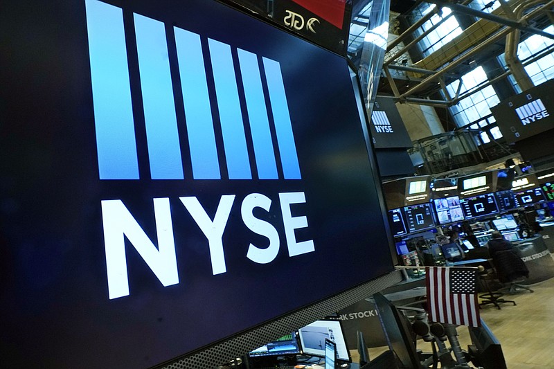 FILE - Logos the New York Stock Exchange adorn trading posts, on the floor, Wednesday, March 16, 2022.  Stocks rose in morning trading on Wall Street Tuesday, March 22,  and oil prices eased back amid heightened concerns about inflation.  (AP Photo/Richard Drew, File)