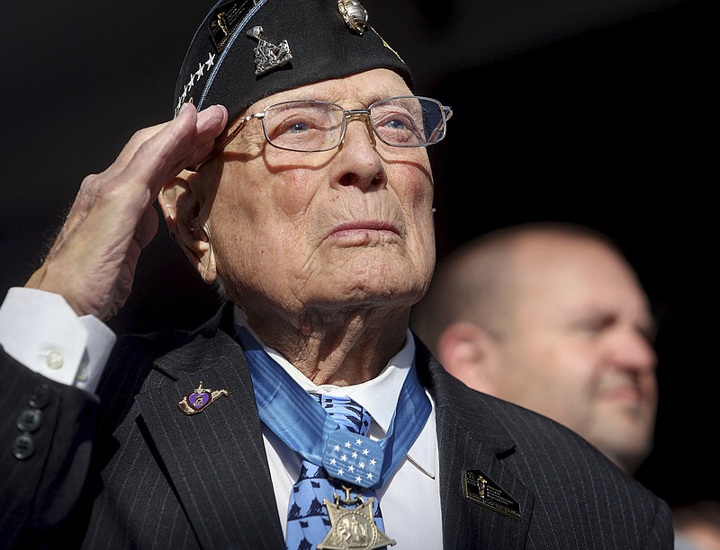 Hershel Woodrow Williams, a World War II veteran and recipient of the Medal of Honor, salutes the flag during the national anthem at the groundbreaking ceremony for the National Medal of Honor Museum, Friday, March 25, 2022, in Arlington, Texas. (Amanda McCoy/Star-Telegram via AP)