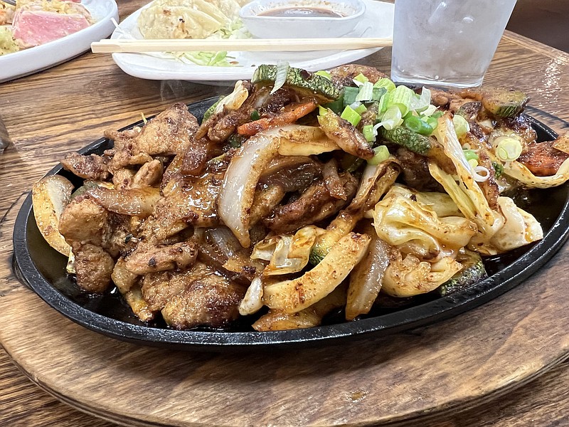 Marinated Pork, off the Korean Barbecue menu, came on a sizzling plate, not grilled tableside, as the menu promised, at Kiyen’s at Kamikaito on Main Street in North Little Rock’s Argenta District. (Arkansas Democrat-Gazette/Eric E. Harrison)