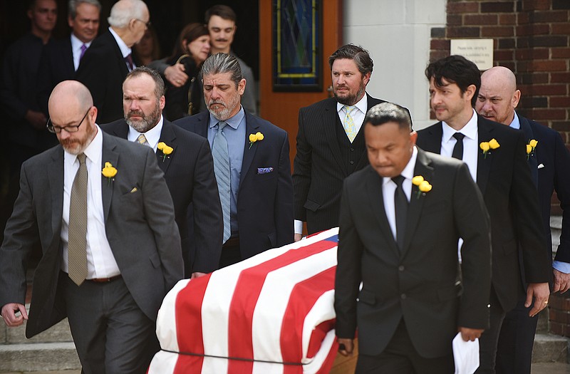 The casket of Brent Renaud is carried out of the sanctuary at Pulaski Heights United Methodist Church following the funeral service Saturday, March 26, 2022 in Little Rock.
(Arkansas Democrat-Gazette/Staci Vandagriff)