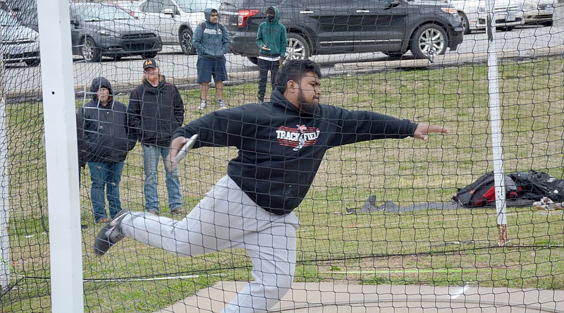 GRAHAM THOMAS/MCDONALD COUNTY PRESS
McDonald County's Junior Eliam throws the discus for the Mustangs in the Ebenee Munoz Memorial Stampede on Thursday, March 24.