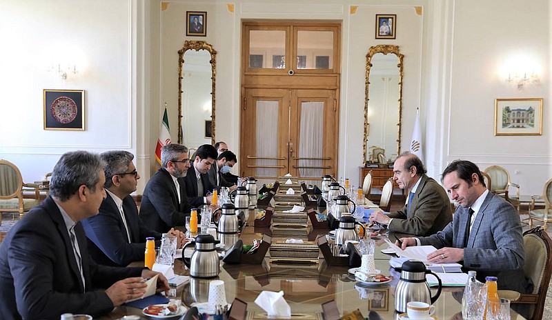 In this photo released by the Iranian Foreign Ministry, Enrique Mora, a leading European Union diplomat, second right, attends a meeting with Iran's top nuclear negotiator Ali Bagheri Kani, third left, in Tehran, Iran, Sunday, March 27, 2022. Mora held talks in Tehran amid hopes that an agreement to restore Iran's tattered nuclear deal with world powers could be completed. Others are unidetified. (Iranian Foreign Ministry via AP)