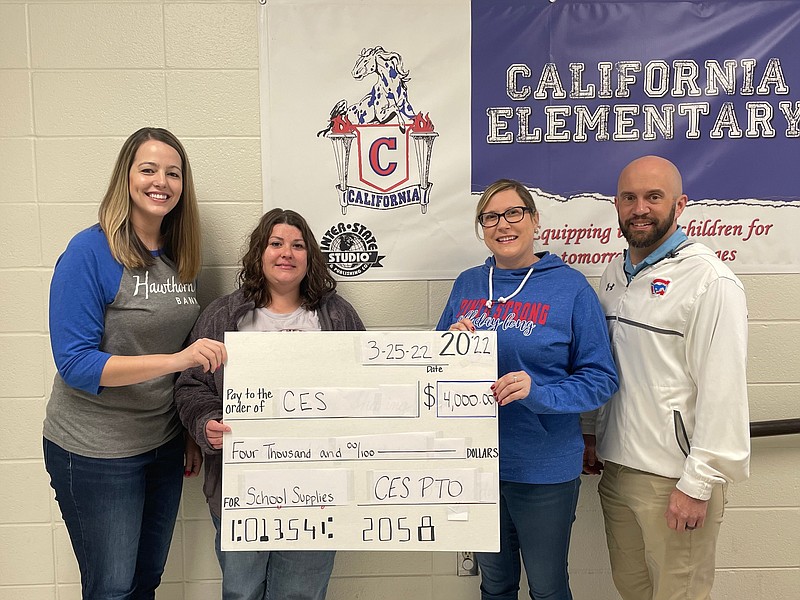 Democrat photo/Kaden Quinn 
California Elementary School PTO Secretary Rebecca Wood and President Ashley Baker present a $4,000 check to CES Supply Committee Head Kimberly Shewmake and CES Principal Gary Baker to go toward school supplies for the upcoming year.