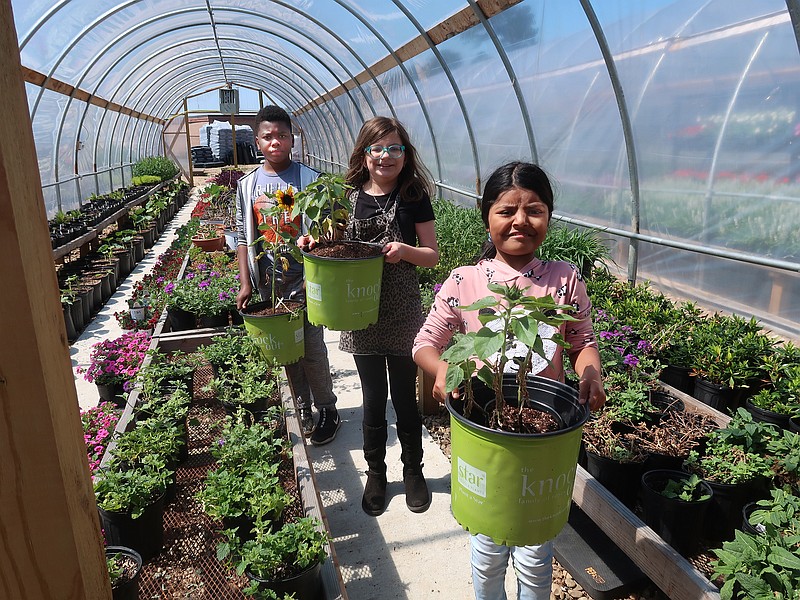 When the weather warms up for spring, ACCESS Academy students transfer their larger plants to holding beds next to their greenhouse and high tunnels on the campus at 1500 N. Mississippi St. (Special to the Democrat-Gazette/Janet B. Carson)