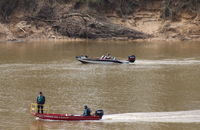 Photo by Michael Hanich
Boats search along the Ouachita River as part of a recovery effort for a 17 year old male who went missing in the river Sunday.