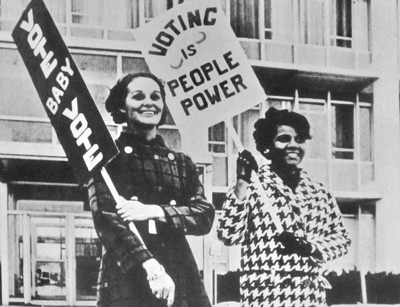Signs encouraging women to vote have long been part of equality activism. (Special to the Democrat-Gazette/Jack Schnedler)