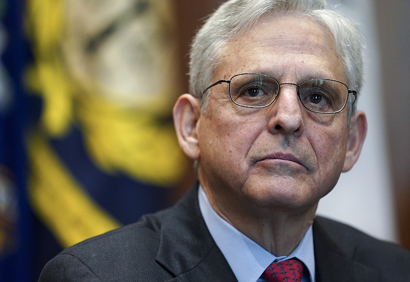 FILE - Attorney General Merrick Garland listens during a meeting of the COVID-19 Fraud Enforcement Task Force at the Justice Department, March 10, 2022 in Washington. (Kevin Lamarque/Pool via AP, File)