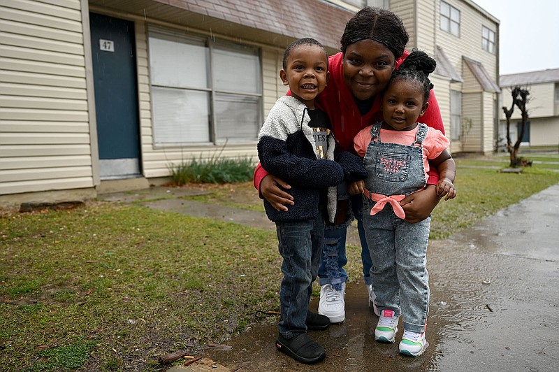 Jasmine James poses for a photo with her kids Antonio Adams Jr., left, and Aurielle Adams at Willowbend Apartments in Jacksonville on Tuesday, March 22, 2022.

(Arkansas Democrat-Gazette/Stephen Swofford)