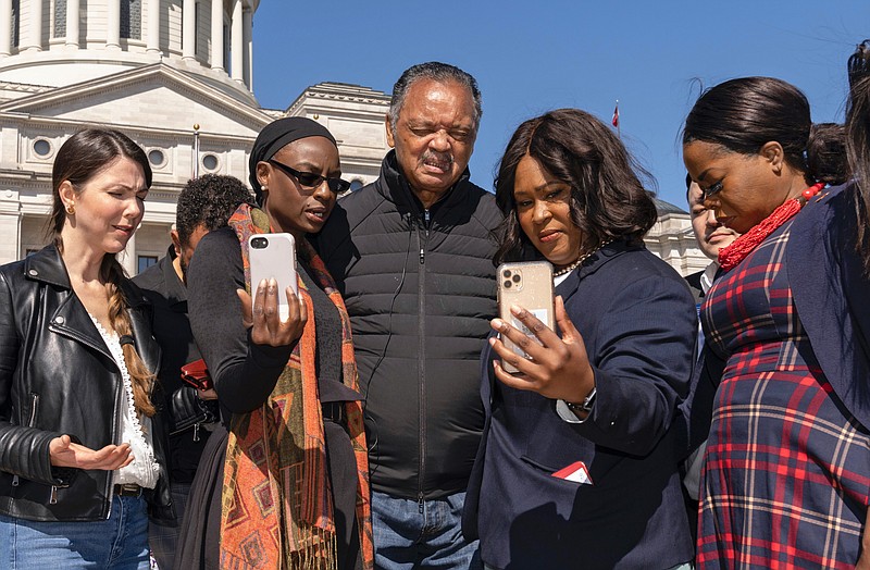 The Rev. Jesse Jackson leads a group in prayer at the Arkansas State Capitol in Little Rock, on Sunday. Jackson spoke to a small group of Democratic candidates and supporters. (Arkansas Democrat-Gazette/David Hoge)