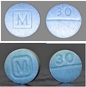 Authentic oxycodone M30 tablets, top, vs. counterfeit oxycodone M30 tablets containing fentanyl, bottom, as pictured on a May 2021 fact sheet issued by the U.S. Drug Enforcement Administration. (Submitted photo)