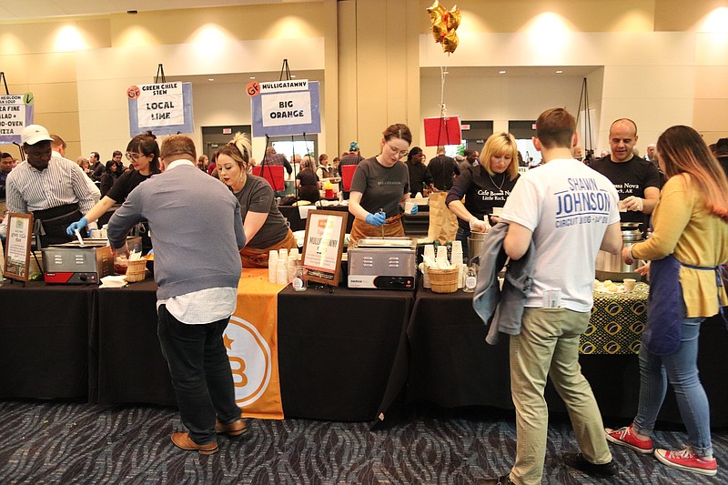 Attendees sample the wares at the 2020 Soup Sunday, benefiting Arkansas Advocates for Children and Families, in the Wally Allen Ballroom at Little Rock's Statehouse Convention Center. (Democrat-Gazette file photo/Helaine R. Williams)