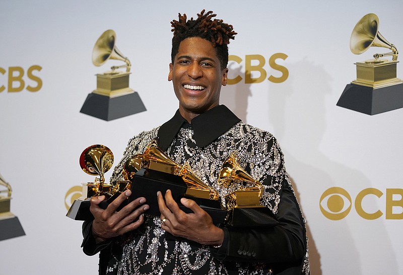 Jon Batiste, winner of the awards for best American roots performance for &quot;Cry,&quot; best American roots song for &quot;Cry,&quot; best music video for &quot;Freedom,&quot; best score soundtrack for visual media for &quot;Soul,&quot; and album of the year for &quot;We Are,&quot; poses in the press room at the 64th Annual Grammy Awards at the MGM Grand Garden Arena on Sunday, April 3, 2022, in Las Vegas. (AP Photo/John Locher)