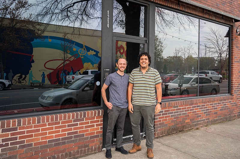 El Sur Street Food owners Luis Vasquez and Darren Strayhorn pose in front of the former Esters, 1214 Main St., in Little Rock’s SoMa neighborhood, where they have announced they will open a brick-and-mortar space this summer. (Special to the Democrat-Gazette)
