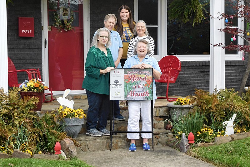 Master Gardeners Cindy Bright, front, left, and Gaye Harper are shown with back, from left, Master Gardener Linda Doherty, Kristin Mangham, marketing director for Garvan Woodland Gardens, and homeowner Golden Lloyd. Not pictured are Master Gardeners Carolyn Davis and Jennetta Sanders. - Submitted photo