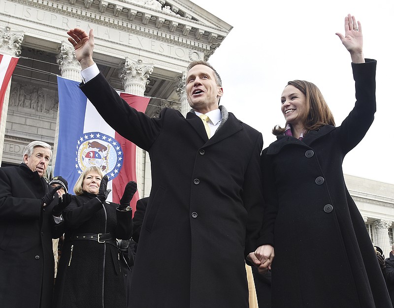 Then Missouri Lt. Gov. Mike Parson, lower left, and his wife, Teresa, look on as newly sworn in governor, Eric Greitens, and his wife, Sheena, wave to attendees at Greitens' inauguration in January 2017. (News Tribune file photo)