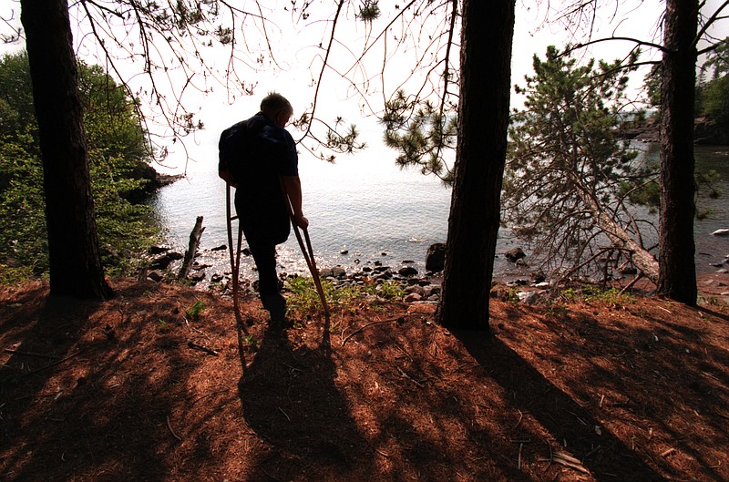 In 1998, Alden Lind stood among the pines overlooking Lake Superior at the former site of Twin Points Resorts, which his family owned and operated for several decades. (Marlin Levison/Minneapolis Star Tribune/TNS)